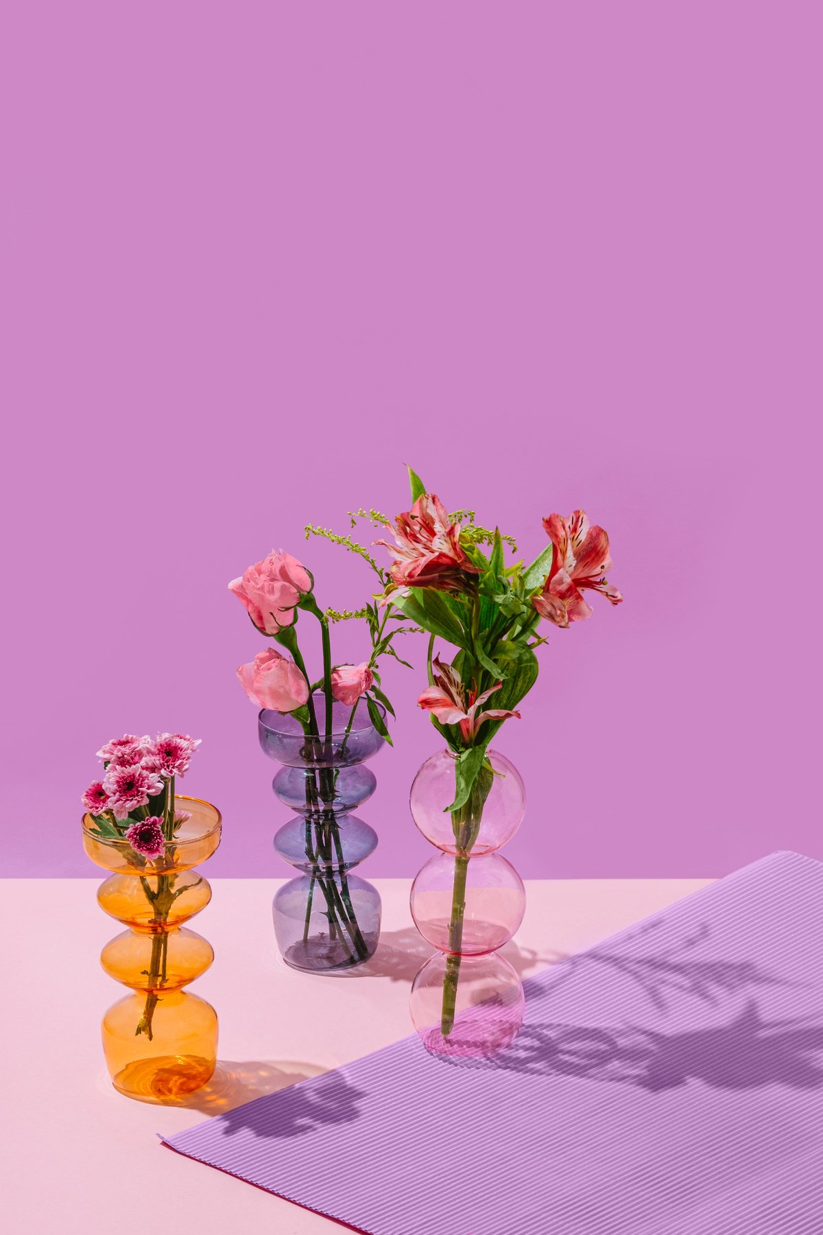 Assorted Flowers in Clear Glass Vases